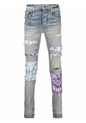 AMIRI bandana-underlay distressed slim-fit jeans - Blue