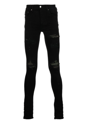 AMIRI ripped-detail denim jeans - Black