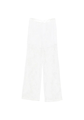 Isabelle Blanche floral-motif trousers - White