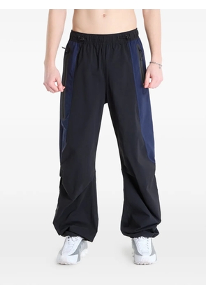 Nike Dri-FIT colourblock woven track pants - Black