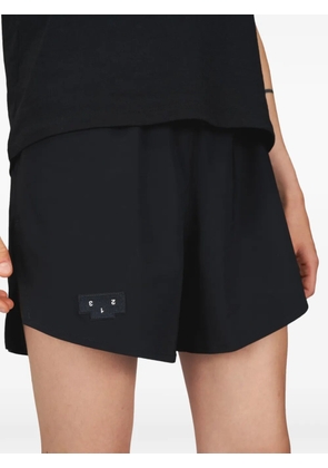 UNNA Tempo logo-patch shorts - Black
