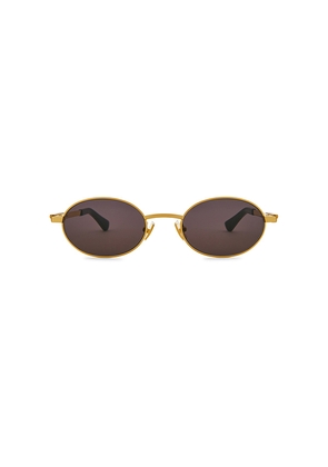 Bottega Veneta Oval Sunglasses in Metallic Gold.