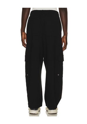 WE11DONE Wide Fit Cargo Pants in Black. Size L. Also in S, M, XL/1X.