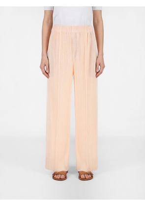 Pants HOMME PLISSE' ISSEY MIYAKE Men color Pink