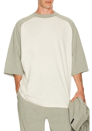 Fear of God ESSENTIALS Signature Baseball Tee in Oatmeal & Concrete Heather - Cream. Size L (also in M, S, XL/1X, XS, XXL/2X, XXXL/3X).