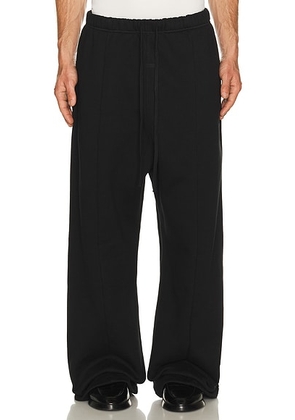 Fear of God ESSENTIALS Signature Lounge Sweatpant in Black - Black. Size L (also in M, S, XL/1X, XS, XXL/2X, XXXL/3X).
