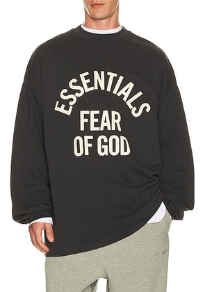 Fear of God ESSENTIALS Campus 90's Long Sleeve Tee in Faded Black - Black. Size L (also in M, S, XL/1X, XS, XXL/2X, XXXL/3X).