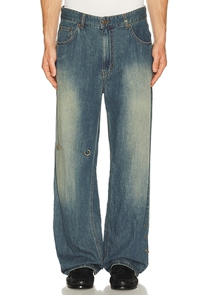 WE11DONE Piercing Denim Jeans in Indigo Blue - Blue. Size L (also in M, S, XL/1X).