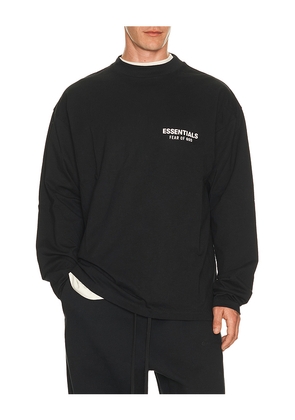 Fear of God ESSENTIALS Classic Fit Long Sleeve T-Shirt in Vintage Black / White in Black. Size L. Also in M, S, XL/1X, XS, XXL/2X.
