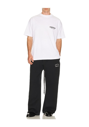 Fear of God ESSENTIALS Classic Fit T-Shirt in White. Size M. Also in S, XS, L, XL/1X, XXL/2X.