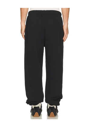 Fear of God ESSENTIALS Classic Sweatpant in Black. Size L. Also in S, XS, M, XL/1X, XXL/2X.