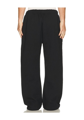 Fear of God ESSENTIALS Flare Sweatpant in Black. Size L. Also in S, XS, M, XL/1X, XXL/2X.