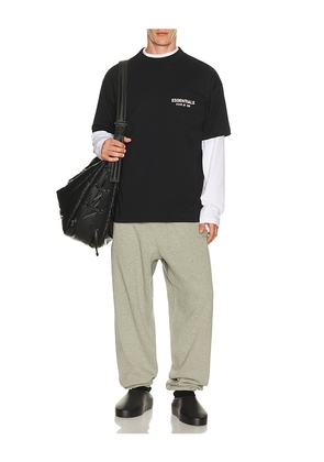 Fear of God ESSENTIALS Classic Fit T-Shirt in Black. Size L. Also in S, XS, M, XL/1X, XXL/2X.