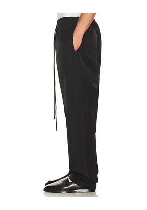 Fear of God ESSENTIALS Active Trace Relaxed Drawstring Pant in Black. Size L. Also in XS, S, M, XL/1X, XXL/2X, XXXL/3X.
