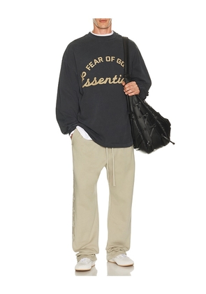Fear of God ESSENTIALS Training 90's Long Sleeve Tee in Black. Size L. Also in XS, S, M, XL/1X, XXL/2X, XXXL/3X.