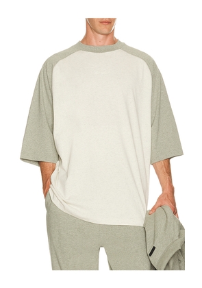 Fear of God ESSENTIALS Signature Baseball Tee in Cream. Size L. Also in M, S, XL/1X, XS, XXL/2X, XXXL/3X.