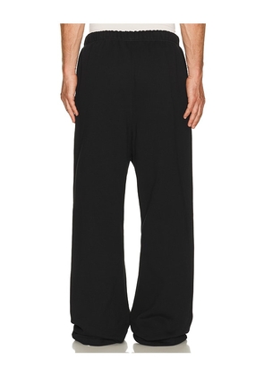 Fear of God ESSENTIALS Signature Lounge Sweatpant in Black. Size L. Also in XS, S, M, XL/1X, XXL/2X, XXXL/3X.
