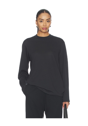 Fear of God ESSENTIALS Signature Classic Long Sleeve Tee in Black. Size L. Also in M, S, XL, XS.