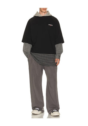 WE11DONE Multi-Layered Hoodie in Black. Size L. Also in S, M, XL/1X.