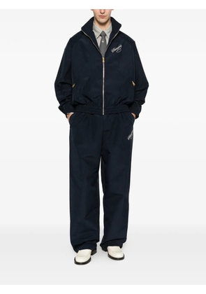 Willy Chavarria striped-pattern trousers - Blue