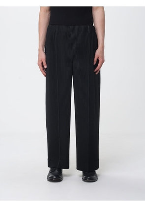 HOMME PLISSE' ISSEY MIYAKE Pants Men color Black