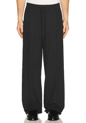 Fear of God ESSENTIALS Pleat Front Pant in Vintage Black - Black. Size M (also in L).