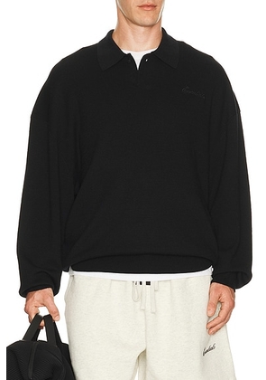 Fear of God ESSENTIALS Signature 90's Knit Polo in Vintage Black - Black. Size XS (also in S, M, L, XL/1X, XXL/2X, XXXL/3X).