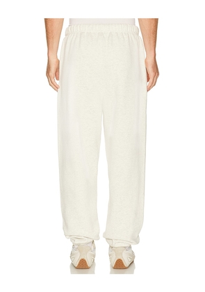 Fear of God ESSENTIALS Classic Sweatpant in Oatmeal Heather/Light Heather in Light Grey. Size S. Also in XS, M, L, XL/1X, XXL/2X.