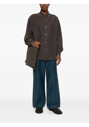 SEWMOD patch-detail garment-dyed jeans - Blue