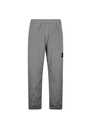 Stone Island logo-patch crinkled trousers - Grey