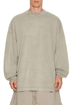Fear of God ESSENTIALS Signature 90's Long Sleeve Tee in Faded Seal - Neutral. Size XS (also in S, M, L, XL/1X, XXL/2X, XXXL/3X).