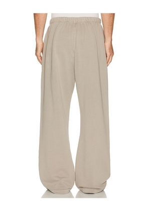 Fear of God ESSENTIALS Training Classic Fit Flare Sweatpant in Nude. Size XS. Also in S, M, L, XL/1X, XXL/2X.