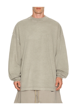 Fear of God ESSENTIALS Signature 90's Long Sleeve Tee in Neutral. Size XS. Also in S, M, L, XL/1X, XXL/2X, XXXL/3X.
