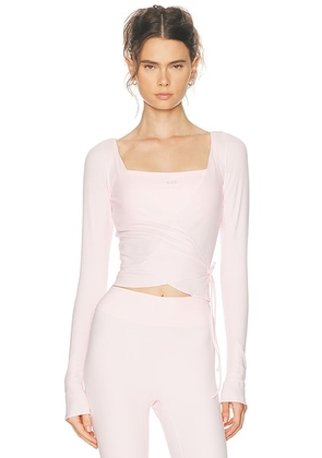 437 Studio Wrap Top in Powder Pink - Pink. Size XS (also in ).
