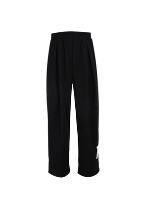 Tee Library Rip-off pleated logo-patch trousers - Black