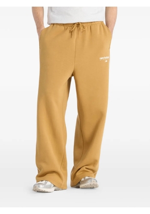 New Balance Trackside Fleece track pants - Yellow