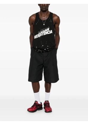 Willy Chavarria logo-print paint-splatter vest - Black