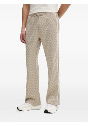GUESS USA monogram-pattern side-stripe track pants - Neutrals
