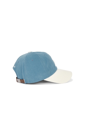 VERUTUM Initial Cap in Blue.