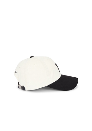 VERUTUM Initial Cap in Cream.