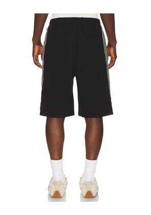 Jungles Knit Panel Shorts in Black. Size L. Also in S, M, XL/1X.