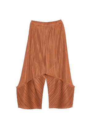 Pleats Please Issey Miyake pleated asymmetric trousers - Brown