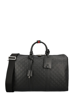 Gucci medium GG Emblem embossed holdall - Black