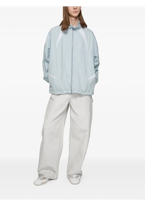 Acne Studios bow-embroidered trousers - White
