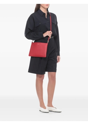 Coccinelle logo-print leather clutch bag - Red