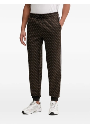 GUESS USA monogram-print side-stripe track pants - Brown