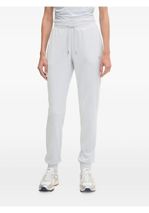 GUESS USA rhinestone-logo track pants - Blue