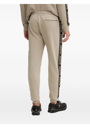 GUESS USA logo-tape track pants - Neutrals