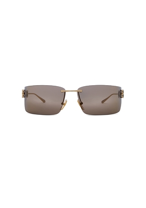 Balenciaga Gossip Sunglasses in Metallic Gold.