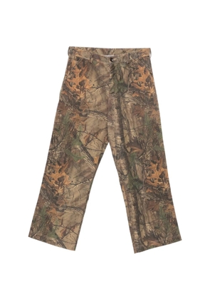 LC23 leaf-print trousers - Brown